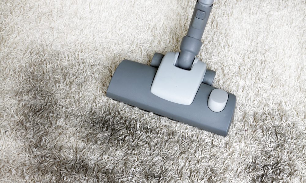 Very dirty carpet getting vacuumed